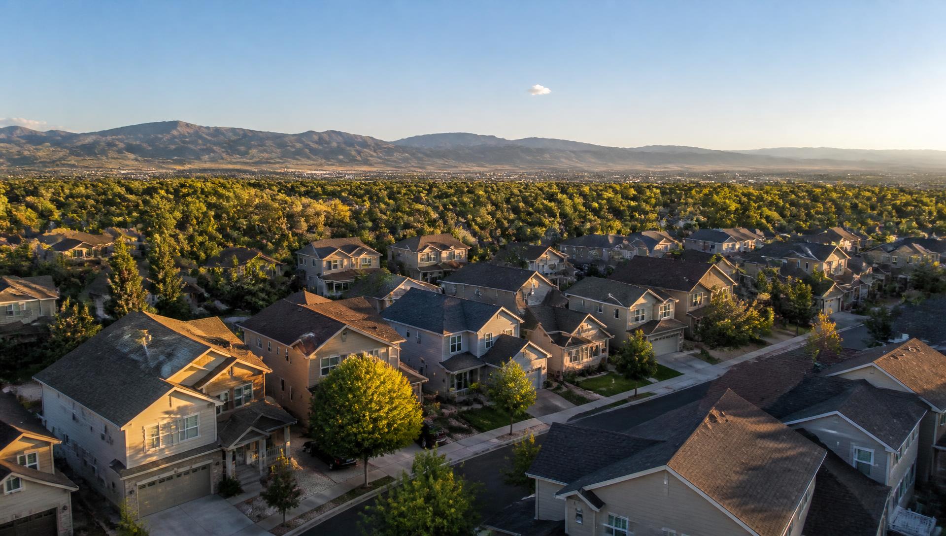 Aerial view of Denver metro residential rooftops at golden hour